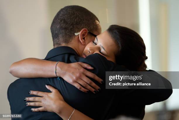 The children of Karlheinz Boehm Aida and Nicolas hug each other at the memorial service of their father Karlheinz Boehm in Salzburg, Germany, 13 June...