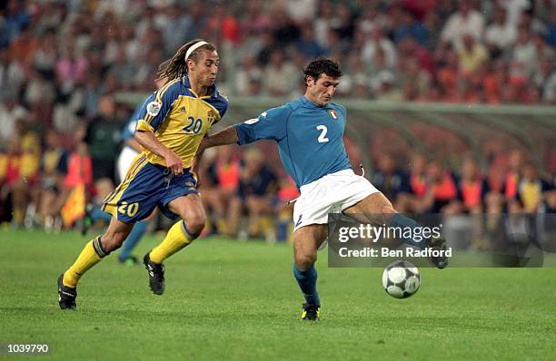 Ciro Ferrara of Italy holds off Henrik Larsson of Sweden during the European Championships 2000 Group B match at the Philips Stadium, Eindhoven,...