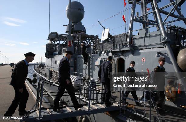 The crew of speed boat 'Ferret' board the ship prior to leaving the naval base in Warnemuende, Germany, 15 April 2013. The corvette heads for Libanon...