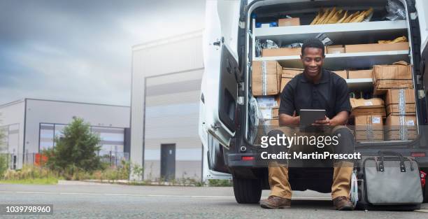 service engineer sat at the back of his van - transportation imagens e fotografias de stock
