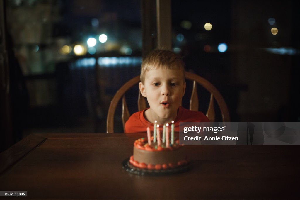 Little blowing out candles
