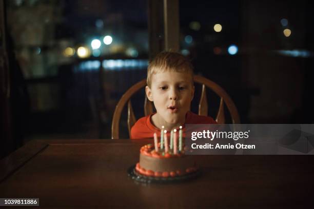 little blowing out candles - kid birthday cake stock pictures, royalty-free photos & images