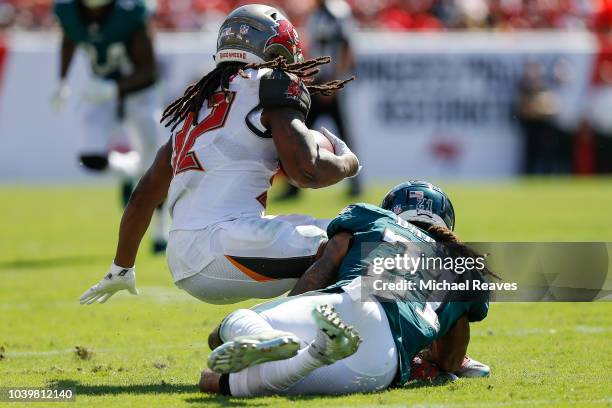 Ronald Darby of the Philadelphia Eagles tackles Jacquizz Rodgers of the Tampa Bay Buccaneers at Raymond James Stadium on September 16, 2018 in Tampa,...