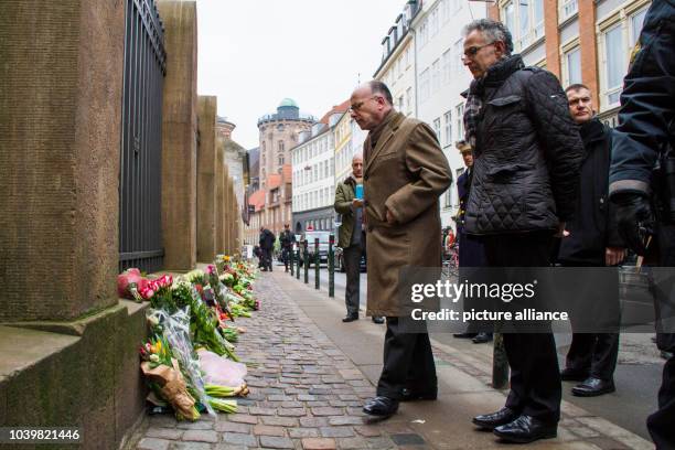 The French Minister of Interior, Bernard Cazeneuve and French Ambassador to Denmark, Francois Zimeray, stand in front of the Yewish synagogue in the...