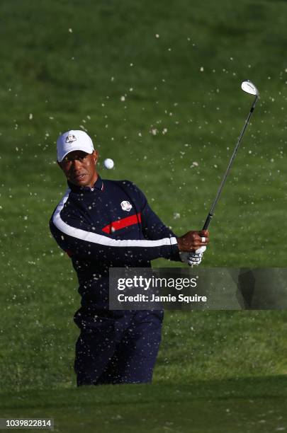 Tiger Woods of the United States plays from a bunker on the 3rd hole during practice ahead of the 2018 Ryder Cup at Le Golf National on September 25,...