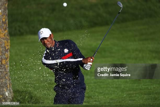 Tiger Woods of the United States plays from a bunker on the 3rd hole during practice ahead of the 2018 Ryder Cup at Le Golf National on September 25,...