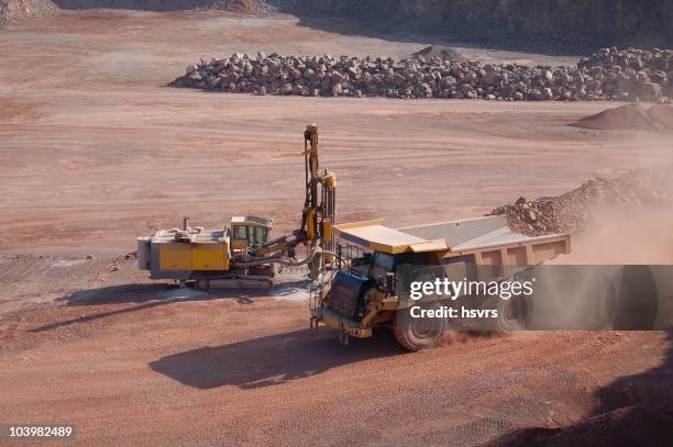 open-pit mine with dump truck and drill - open cast mine stock pictures, royalty-free photos & images