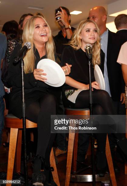 Mary Kate Olsen and Ashley Olsen attend Barneys New York Celebrates Fashion's Night Out at Barneys New York on September 10, 2010 in New York City.