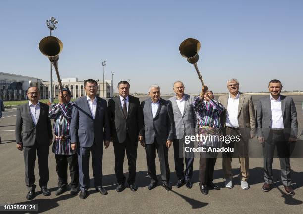Turkish Parliament Speaker Binali Yildirim is welcomed at Samarkand International Airport during his official visit in Samarkand, Uzbekistan on...