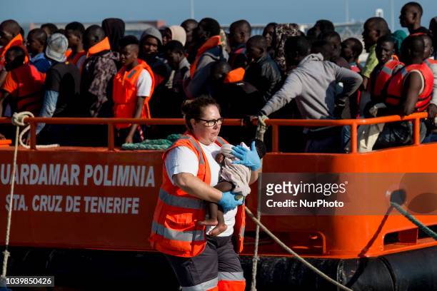 Red cross staff carries a young child to be attended by the medical team in the Malaga port. On 21 September 2018, in Malaga, Spain. 161 persons were...