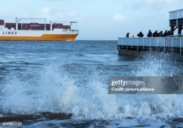 The high water goes over the limit of the bank and floods the area around the 'Alte Liebe' wooden pier in Cuxhaven, Germany, 26 December 2016. The...