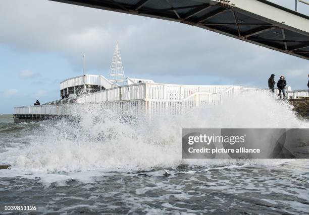 The high water goes over the limit of the bank and floods the area around the 'Alte Liebe' wooden pier in Cuxhaven, Germany, 26 December 2016. The...