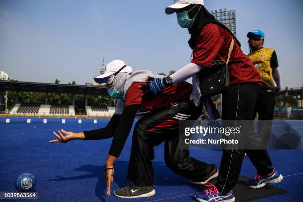 Indonesian player takes part in a lawn bowls practice session, ahead of the 2018 Asian Para Games in Jakarta, Indonesia on Tuesday, September 25,...