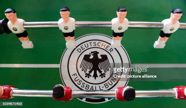 The logo of the German Football Association , is seen on a table football table duirng a press conference at the headquarters of the German Football...