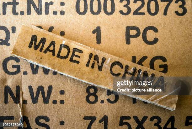 The 'Made in China' label on a product package in Sieversdorf , Germany, 17 February 2016. Photo: Patrick Pleul | usage worldwide