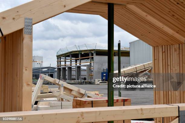 The new building of the company Opitz Holzbau GmbH pictured behind the roof structure in Neuruppin, Germany, 30 March 2016. The 65 employees of the...