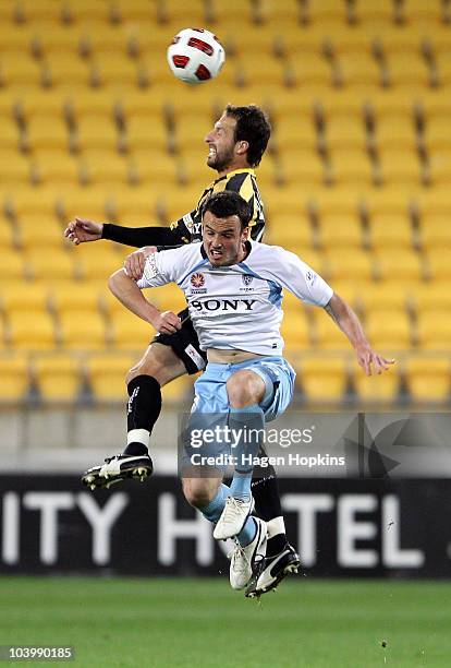 Andrew Durante of the Phoenix and Mark Bridge of Sydney challenge for a header during the round six A-League match between the Wellington Phoenix and...