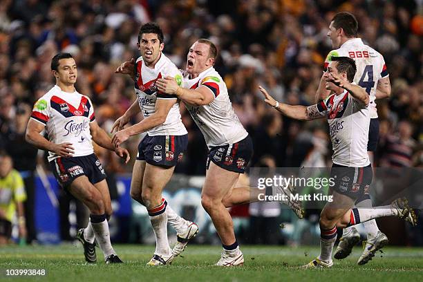 Braith Anasta of the Roosters celebrates with team mates after kicking a field goal to force extra time during the NRL Second Qualifying Final match...