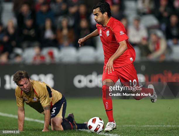 Marcos Flores of Adelaide wrongfoots Ljubo Milicevic of the Jets and goes on to score a goal during the round six A-League match between Adelaide...