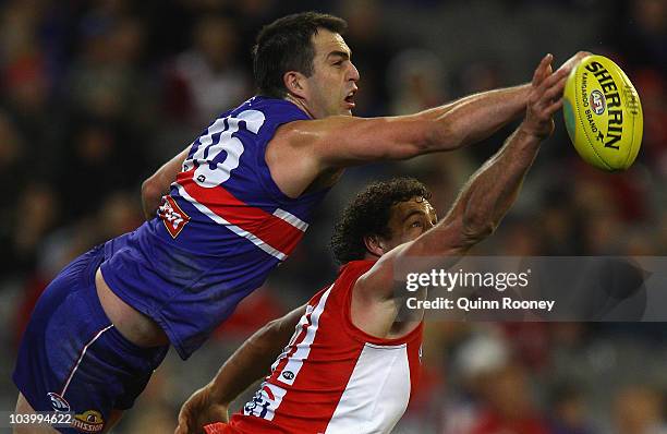 Brian Lake of the Bulldogs spoils a mark by Shane Mumford of the Swans during the AFL First Semi Final match between the Western Bulldogs and the...