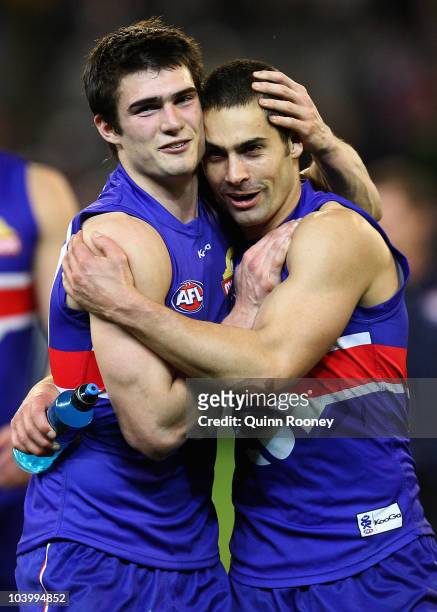 Easton Wood and Daniel Giansiracusa of the Bulldogs celebrate winning the AFL First Semi Final match between the Western Bulldogs and the Sydney...