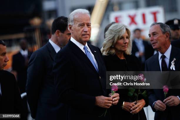 Vice President Joe Biden stands next to his wife Jill Biden and New York Mayor Mike Bloomberg before dropping flowers into a reflecting pool in the...