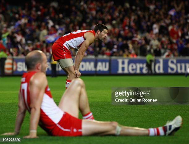 Martin Mattner and Tadhg Kennelly of the Swans look dejected after losing the AFL First Semi Final match between the Western Bulldogs and the Sydney...