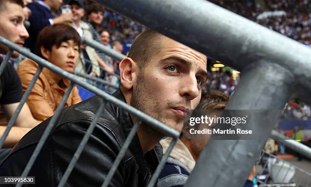Injured player Mladen Petric of Hamburg and watches the match during the Bundesliga match between Hamburger SV and 1. FC Nuernberg at Imtech Arena on...