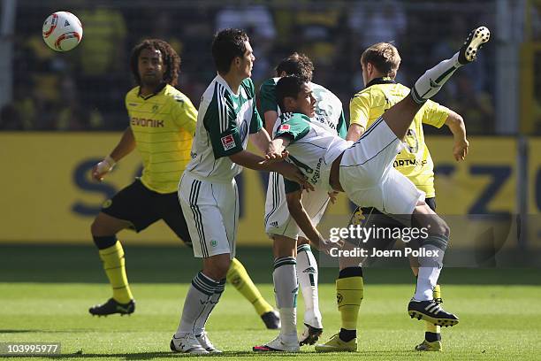 Jakub Blaszczykowski of Dortmund and Cicero of Wolfsburg battle for the ball during the Bundesliga match between Borussia Dortmund and VfL Wolfsburg...