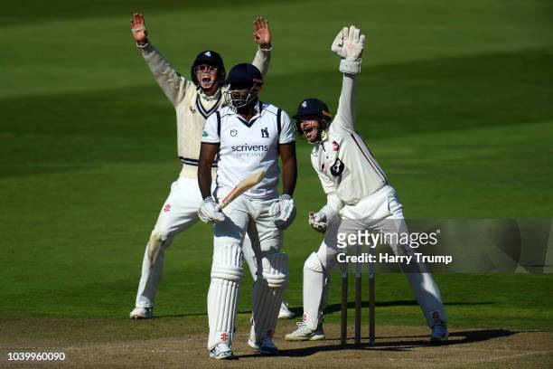 Keith Barker of Warwickshire looks on as he is giving out LBW during Day Two of the Specsavers County Championship Division Two match between...