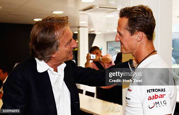 Luca Cordero di Montezemolo, Chairman of Ferrari, talks with Michael Schumacher of Germany and Mercedes GP following qualifying for the Italian...