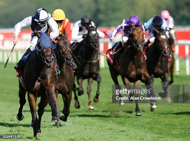William Buick rides Arctic Cosmos to win The Ladbrokes St. Leger Stakes at Doncaster racecourse on September 11, 2010 in Doncaster, England