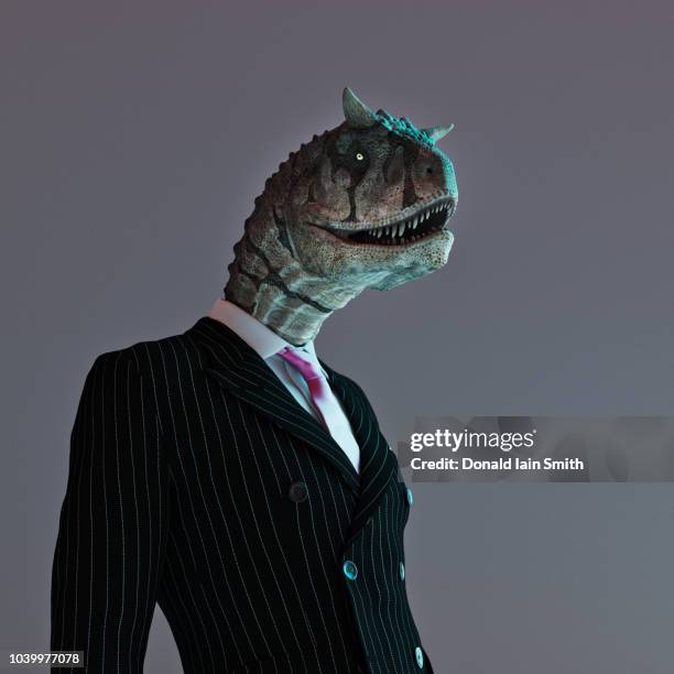 lizard person in business suit with dinosaur head - lizard stock pictures, royalty-free photos & images