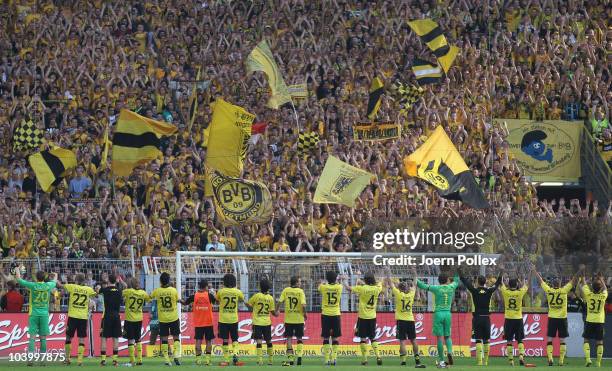 The team of Dortmund is celebrating with the fans after the Bundesliga match between Borussia Dortmund and VfL Wolfsburg at Signal Iduna Park on...