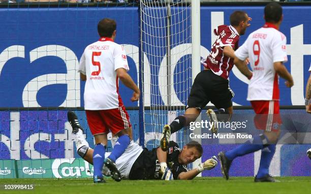 Frank Rost, goalkeeper of Hamburg fouls Julian Schieber of Nuernberg during the Bundesliga match between Hamburger SV and 1. FC Nuernberg at Imtech...