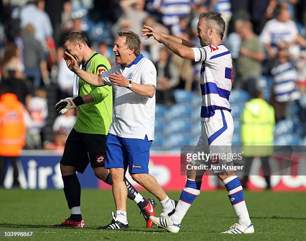Neil Warnock, Manager of Queens Park Rangers share a joke at the final whistle with Shaun Derry and Paddy Kenny, Goalkeeper of Queens Park Rangers...