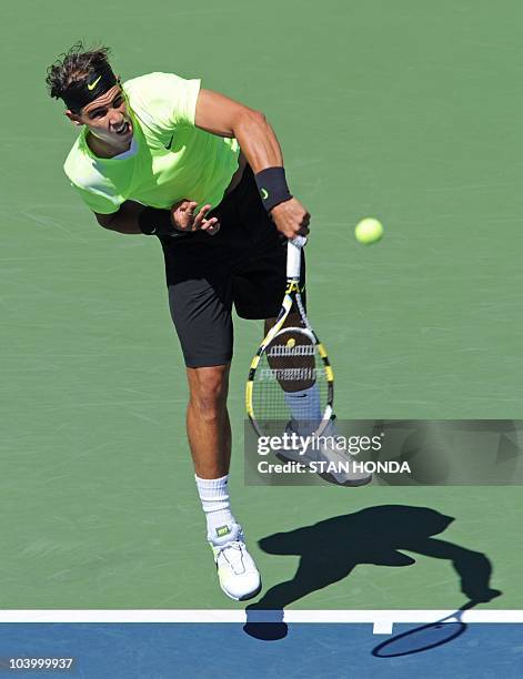 Rafael Nadal of Spain serves to Mikhail Youzhny of Russia in the Men's Semifinals at the US Open 2010 tennis tournament September 11, 2010 in New...