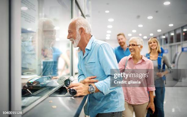 validating the tickets at an airport. - lining up imagens e fotografias de stock