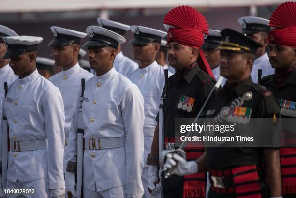 Indian Navy Band and Jammu and Kashmir Light Infantry Regiment perform on the deck INS Kochi during affiliation ceremony of INS Kochi with JAK LI at...