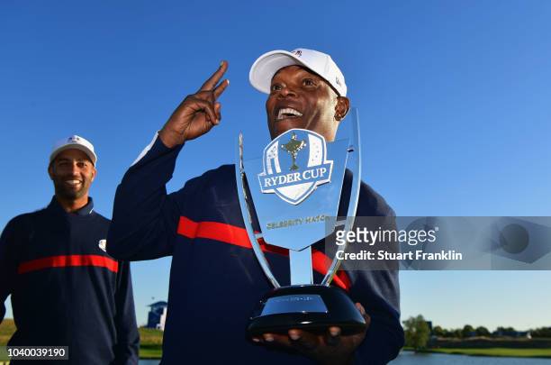 Samuel L Jackson of Team USA celebrates victory with the trophy after the celebrity challenge match ahead of the 2018 Ryder Cup at Le Golf National...
