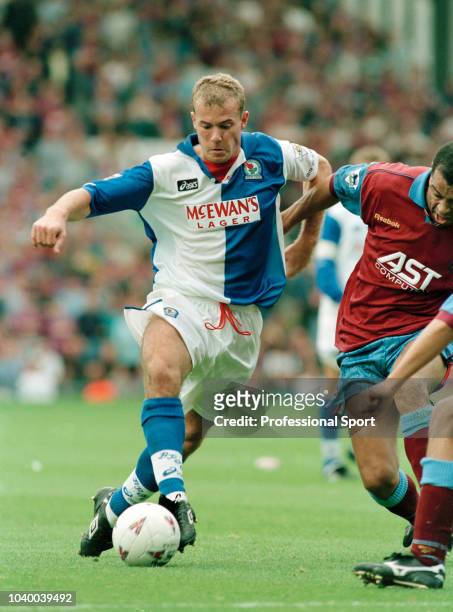 Alan Shearer of Blackburn Rovers takes on Paul McGrath of Aston Villa during an FA Carling Premiership match at Ewood Park on September 9, 1995 in...