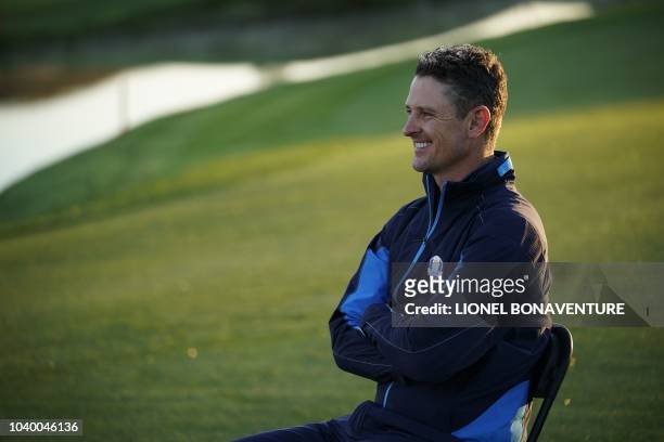 Europe's English golfer Justin Rose poses after a group photograph ahead of the 42nd Ryder Cup at Le Golf National Course at...