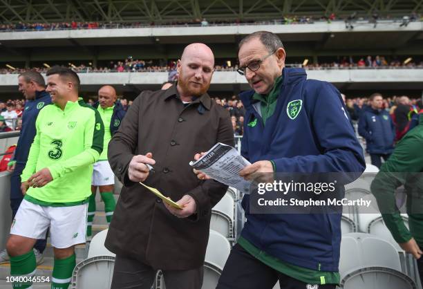 Cork , Ireland - 25 September 2018; Republic of Ireland & Celtic Legends manager Martin O'Neill and John Hartson discuss penalty takers during the...