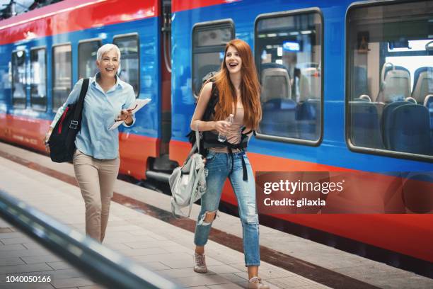 trying to catch a train ride. - priority boarding stock pictures, royalty-free photos & images