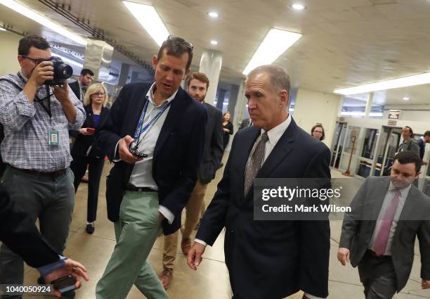 Sen. Thom Tillis is trailed by reporters reporters asking about Supreme Court nominee Brett Kavanaugh at the U.S. Capitol, September 25, 2018 in...