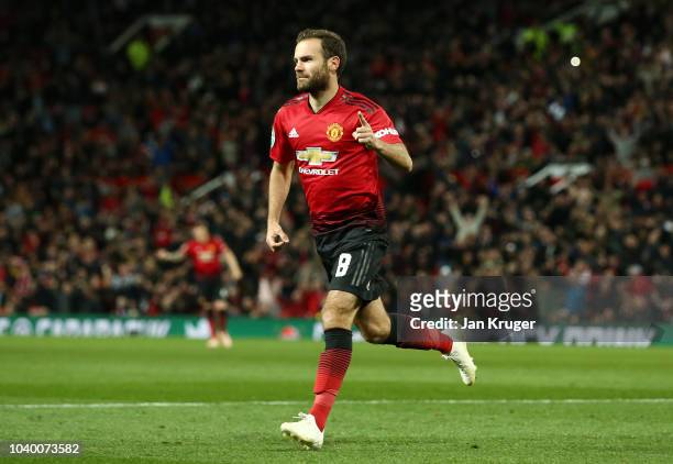 Juan Mata of Manchester United celebrates after scoring his team's first goal during the Carabao Cup Third Round match between Manchester United and...