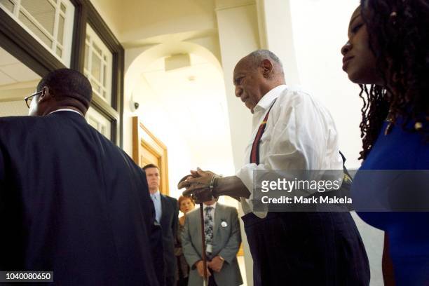 Bill Cosby is taken away in handcuffs after being sentenced to 3-10 years in his sexual assault retrial at the Montgomery County Courthouse on...