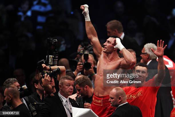 Ukrainian heavyweight champion Wladimir Klitschko celebrates with his brother Vitali after knocking out challenger Samuel Peter of Nigeria during...