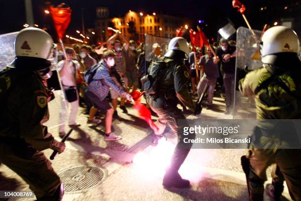 Riot police clash with protestors outside the Thessaloniki International Fair where Greek Prime Minister George Papandreou delivered a keynote speech...
