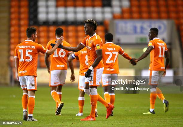 Armand Gnanduillet of Blackpool celebrates with Jordan Thompson after scoring the opening goal during the Carabao Cup Third Round match between...